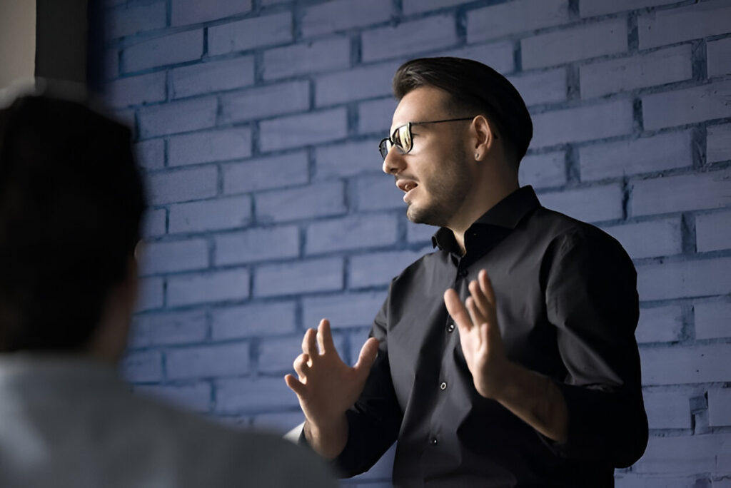 A coaching conversation between two leaders at a table
